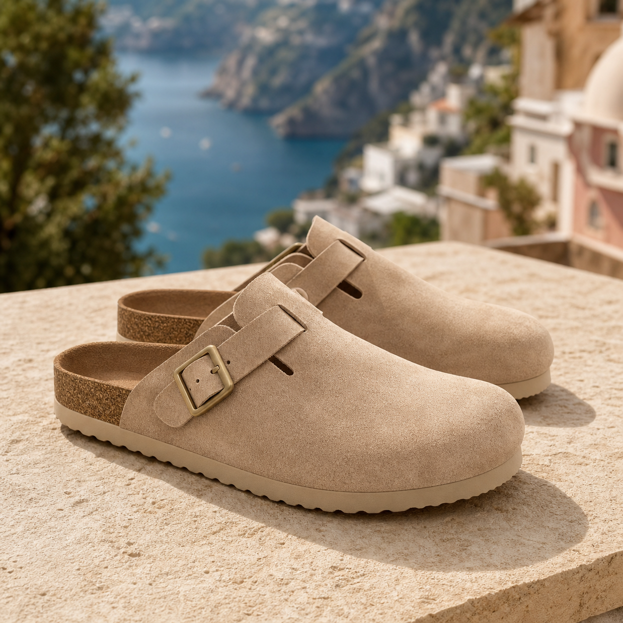 Monte Aure Sorrento Sand Clog sandals on a coastal stone ledge